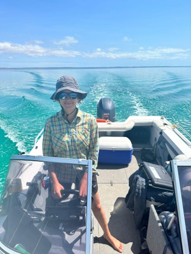 Danai Papageorgiou on a boat doing fieldwork.